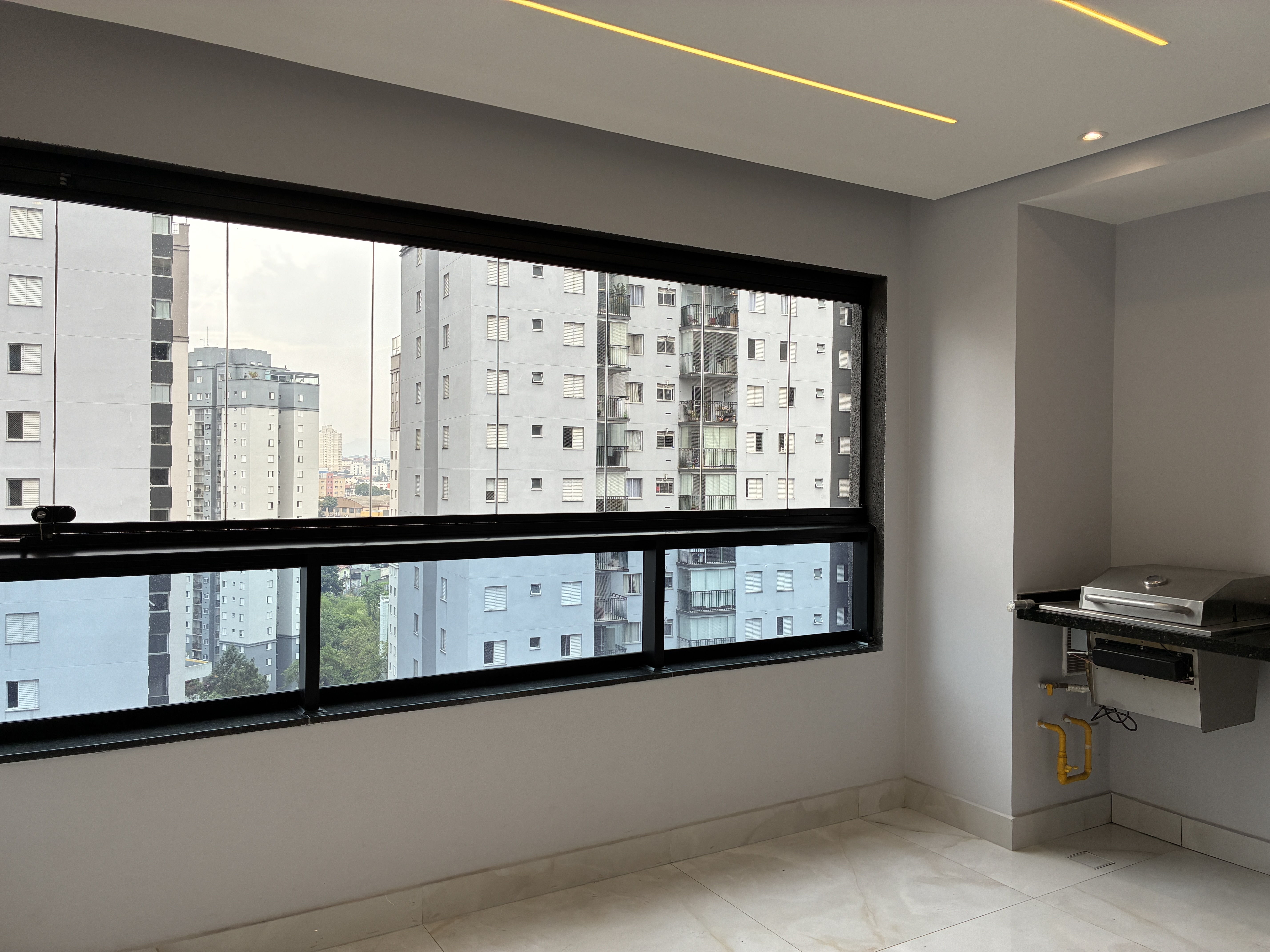 Varanda com churrasqueira a gás